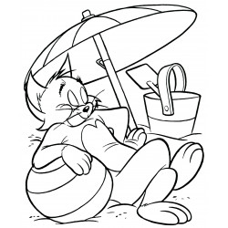 Tom resting under an umbrella